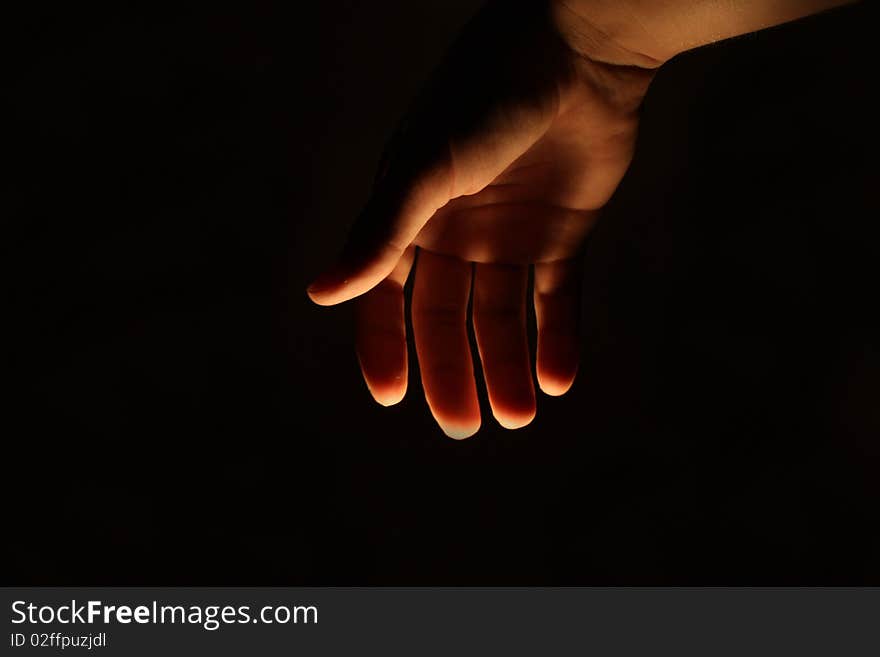 Human man hand lighted from beneath. Human man hand lighted from beneath