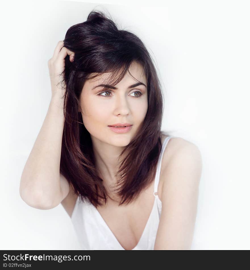 Young happy smiling woman waking up at bedroom