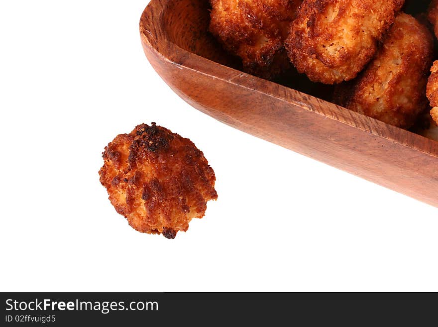 Almond cookies in a wooden plate on a white background. Almond cookies in a wooden plate on a white background.