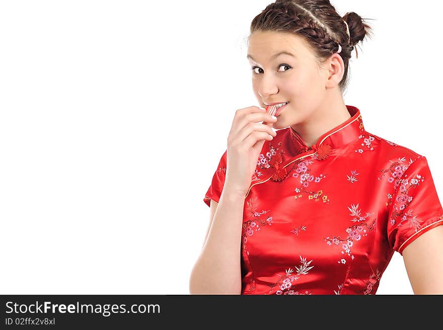 Girl in Chinese dress, eat candy. Girl in Chinese dress, eat candy