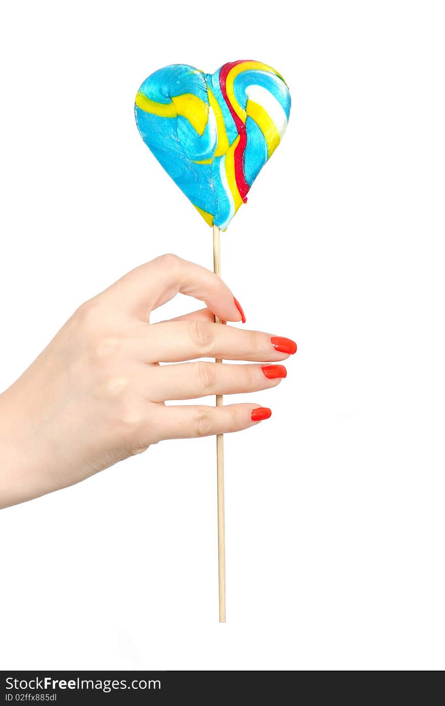 Large colorful lollipop in hand