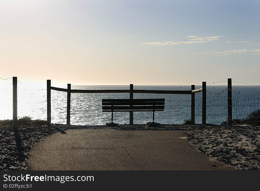 Bench standing on the ocean