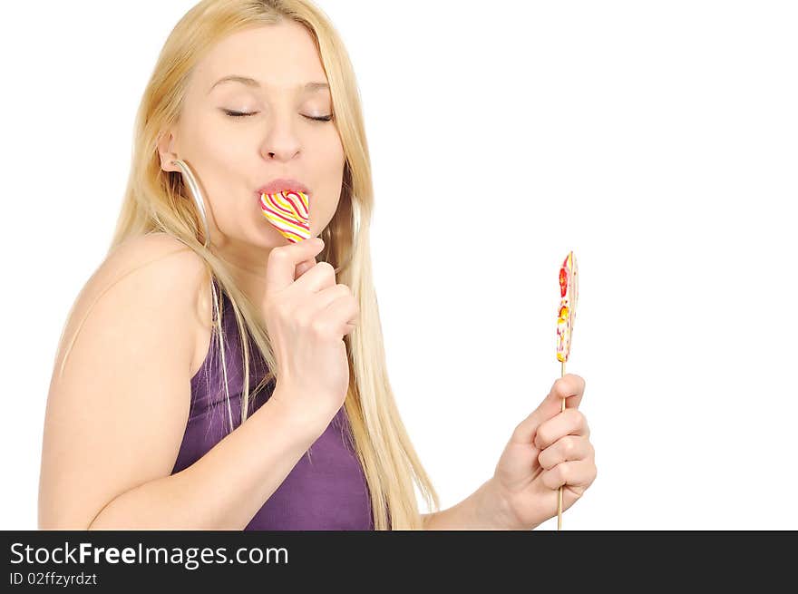 Blondie girl enjoying eating lollipop. Blondie girl enjoying eating lollipop