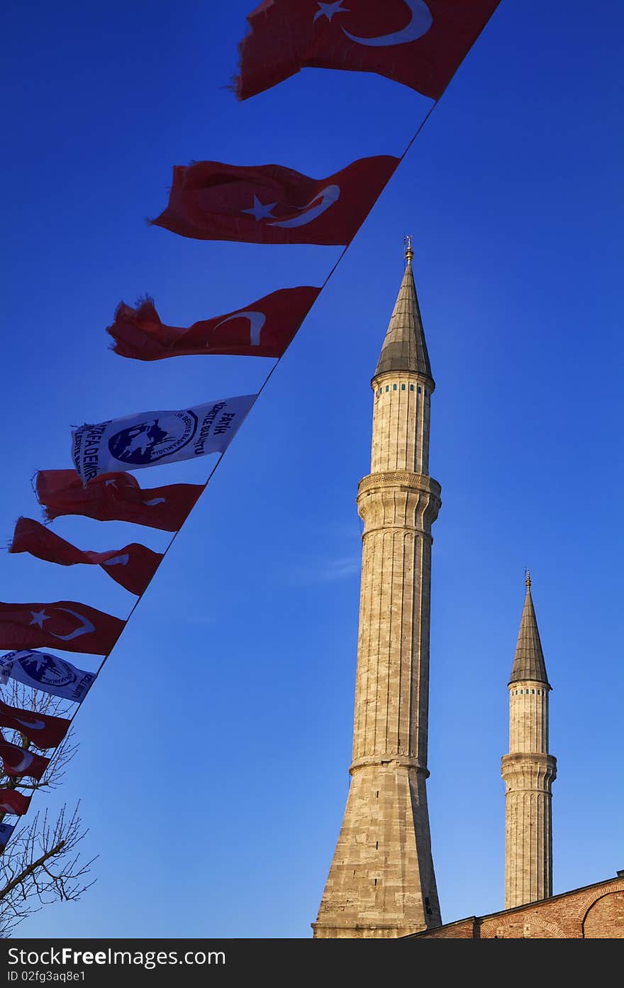 Turkey, Istanbul, turkish flags and St. Sophia Cathedral (built in the 4th century by Costantine the Great and reconstructed in the 6th century by Justinian. Turkey, Istanbul, turkish flags and St. Sophia Cathedral (built in the 4th century by Costantine the Great and reconstructed in the 6th century by Justinian