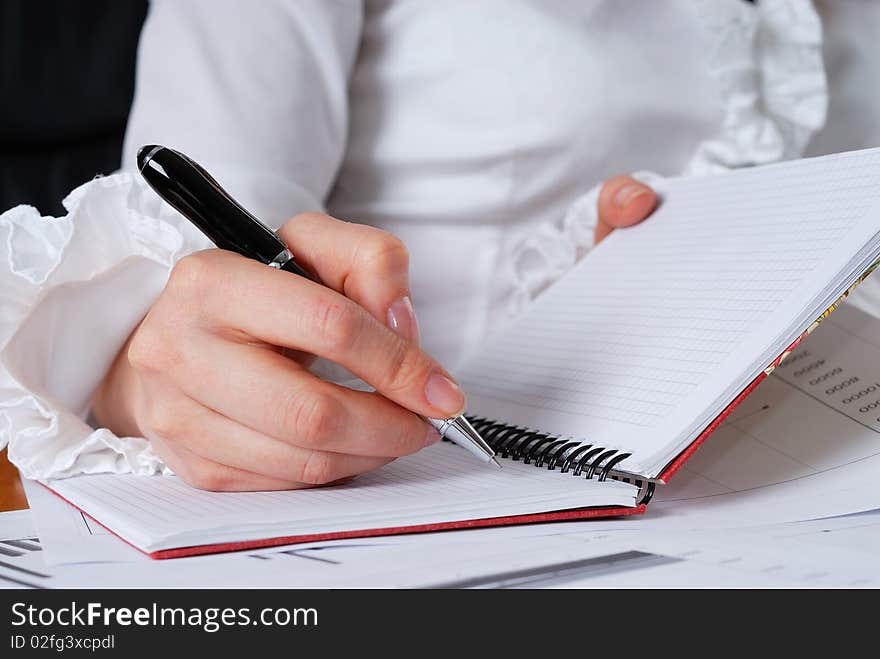 Young businesswoman sign important documents. Young businesswoman sign important documents