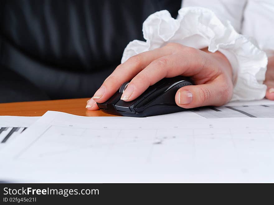 Hands of a young girl working on laptop. Workplace businessman.