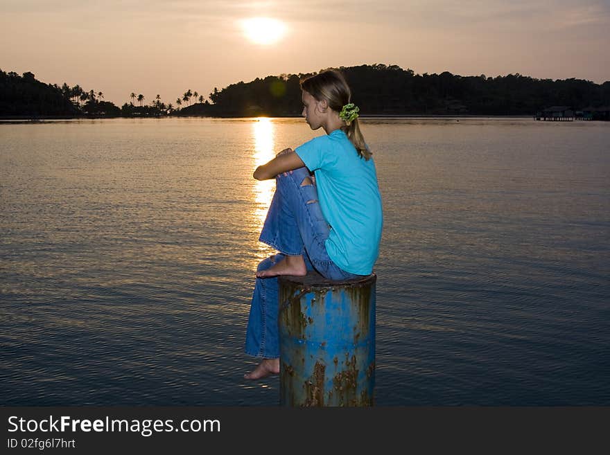 Girl siting on a sunset. Girl siting on a sunset