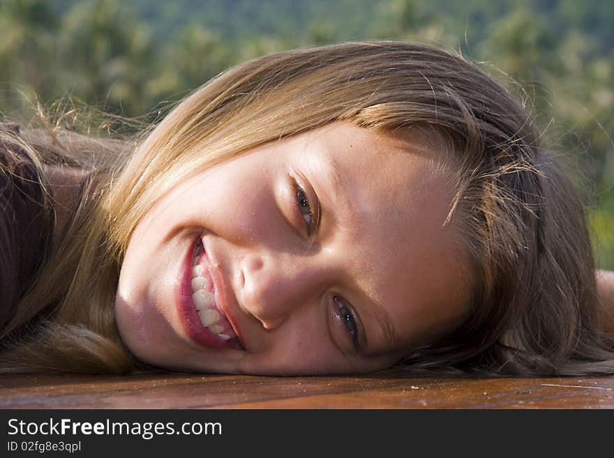 Closeup portrait of charming young girl smiling