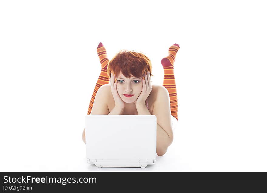 Girl in striped socks look at notebook and worried. Girl in striped socks look at notebook and worried