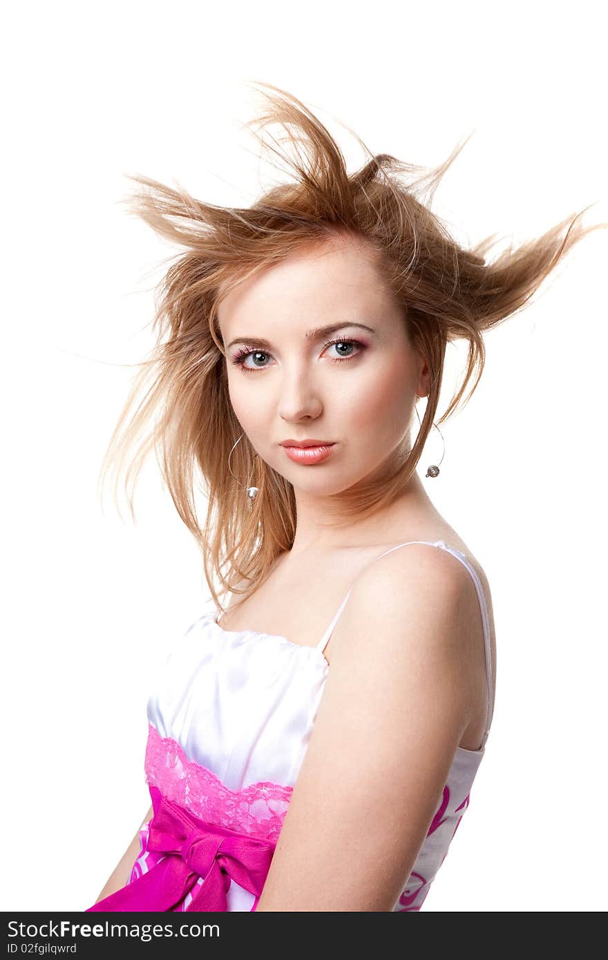 Beautiful girl with flying hair over white