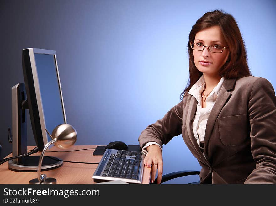 Young businesswoman working in office. Young businesswoman working in office