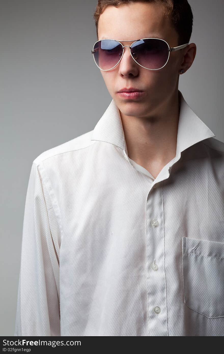 Portrait of young handsome man in sunglasses