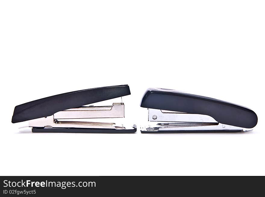 Two black staplers isolated on white background. Two black staplers isolated on white background