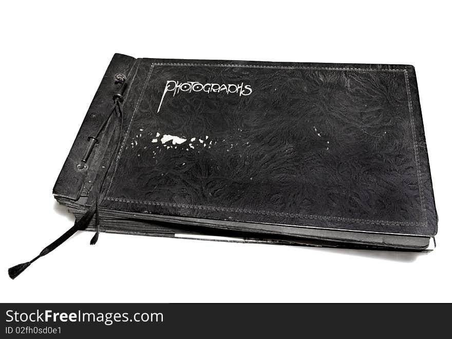 A very old and worn, well used photo album. A very old and worn, well used photo album.