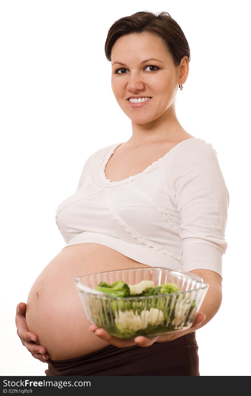 Pregnant woman with vegetables on white background