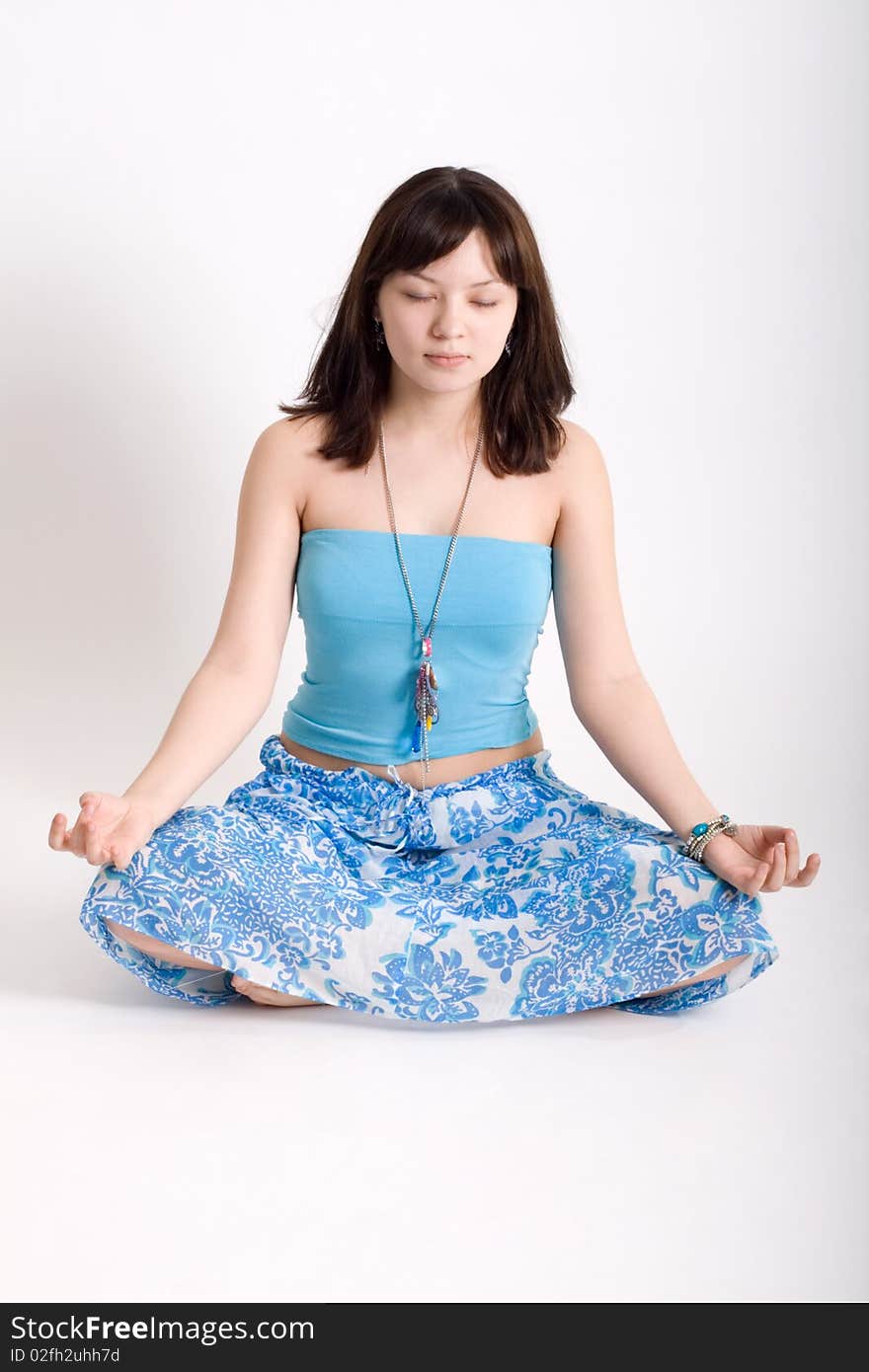 Hippie meditating in a studio