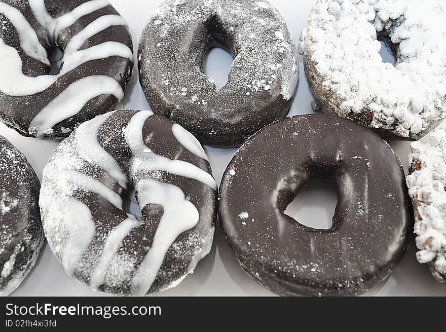 Arrangement of fresh chocolate donuts