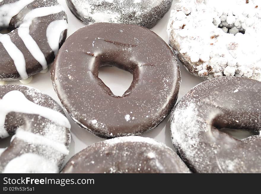 Arrangement of fresh chocolate donuts