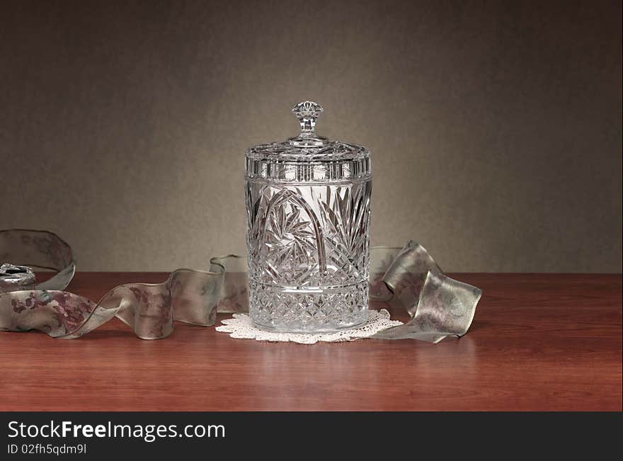 Crystal dish on wood table surface