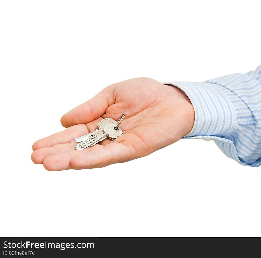 Keys in a man's hand on a white background