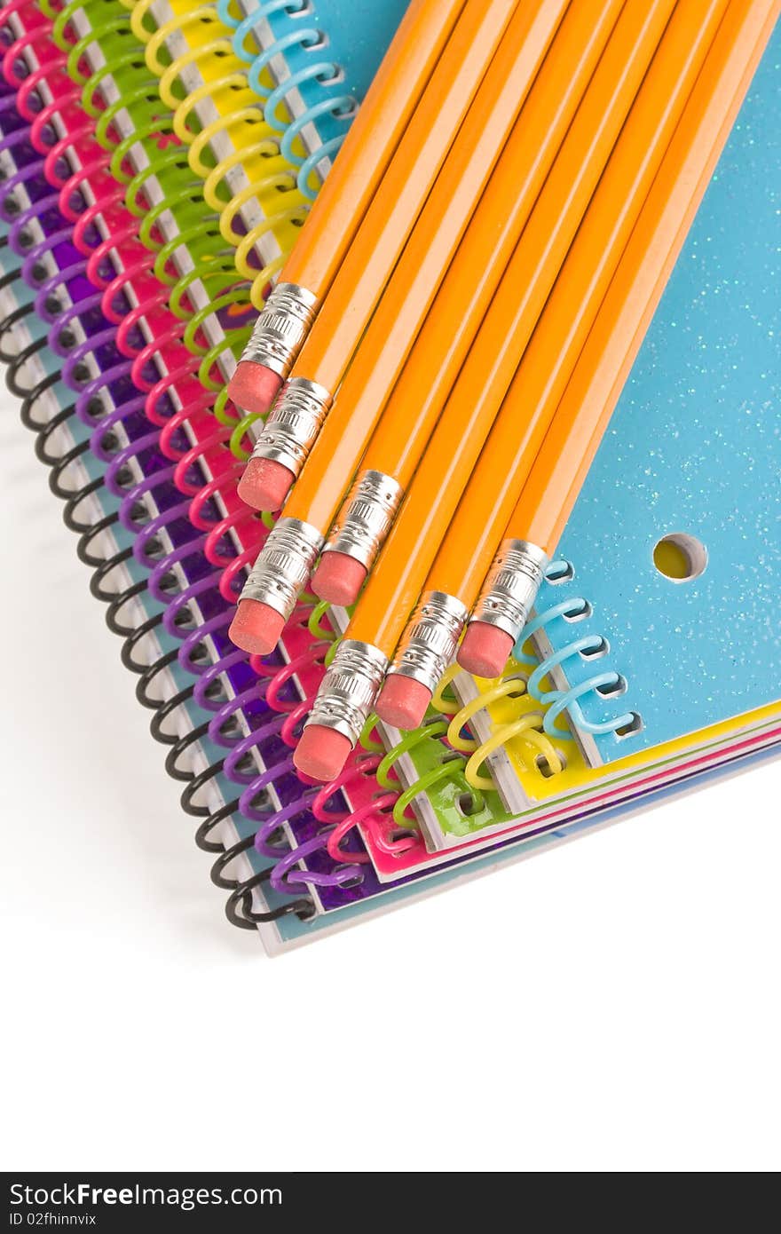 Pencil and colorful notebooks on white. Pencil and colorful notebooks on white