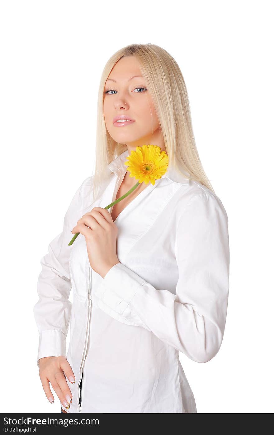 Young charming blonde is playing with a yellow flower isolated on white background