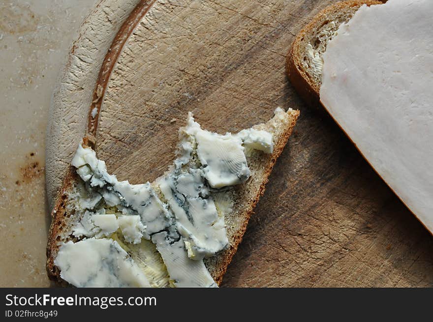 Slice of bread for breakfast with gorgonzola cheese. Slice of bread for breakfast with gorgonzola cheese