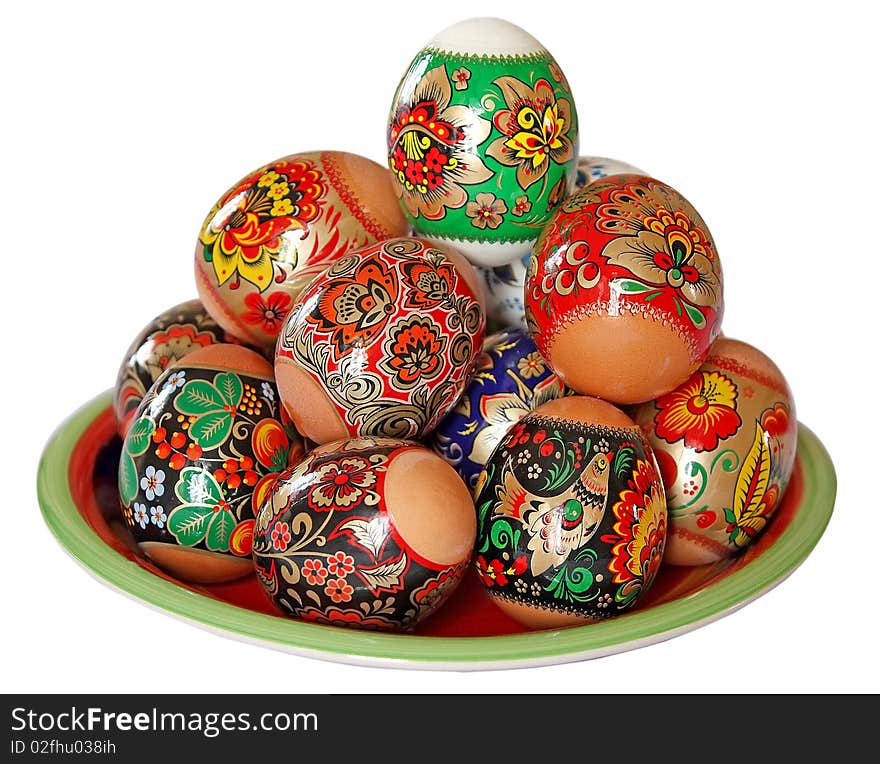 These are the multi-coloured Easter eggs lying on Ð° plate. These are the multi-coloured Easter eggs lying on Ð° plate.