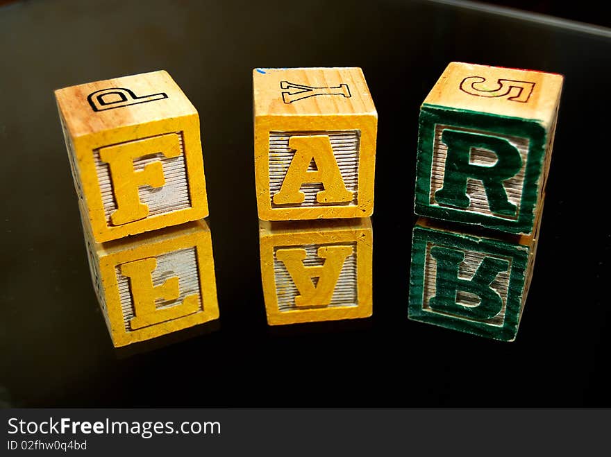 Wooden Kid S Blocks On A Black Background