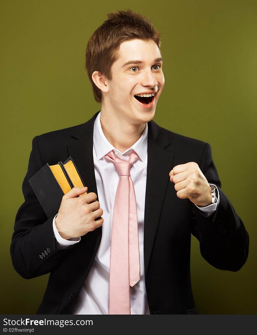 Young handsome caucasian man over green background. Young handsome caucasian man over green background