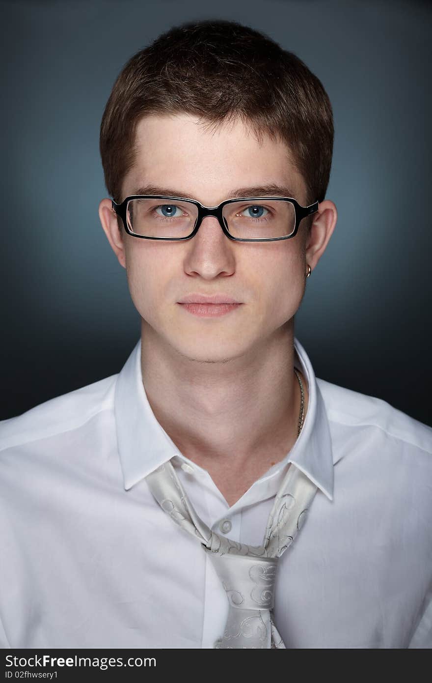 Young handsome caucasian man over grey background. Young handsome caucasian man over grey background