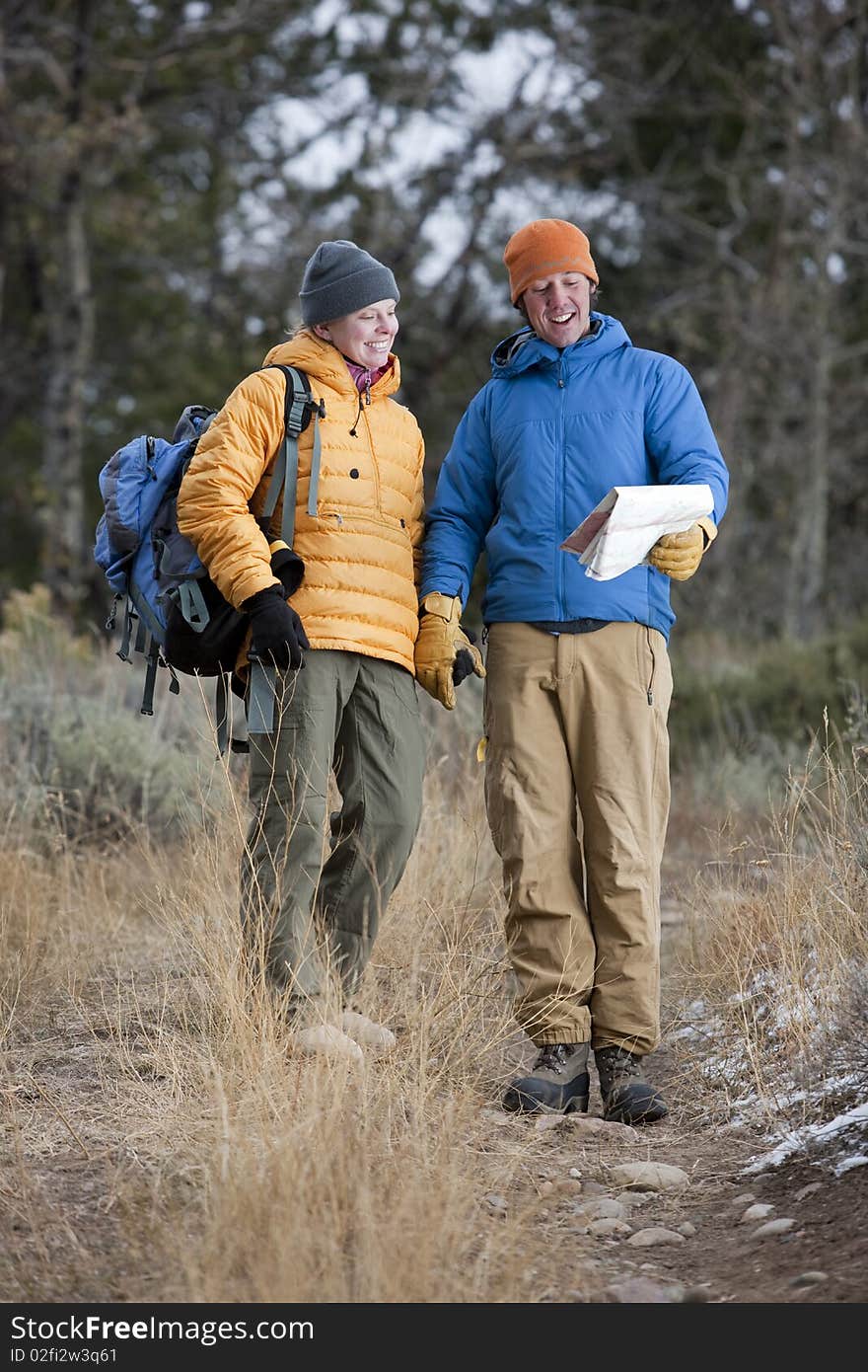 Hiking Couple Looking at Map Together