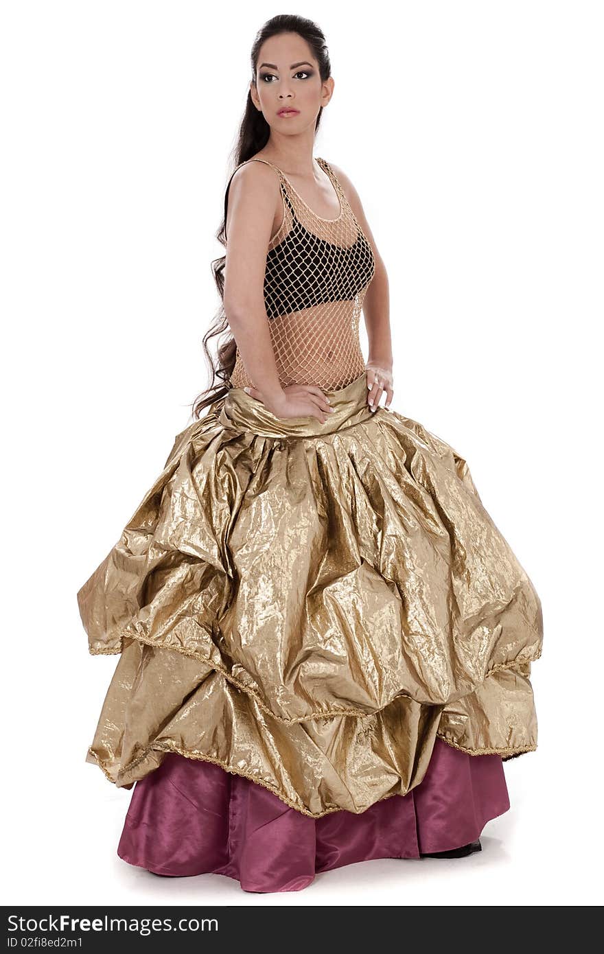 Belly dancer in golden costume dancing