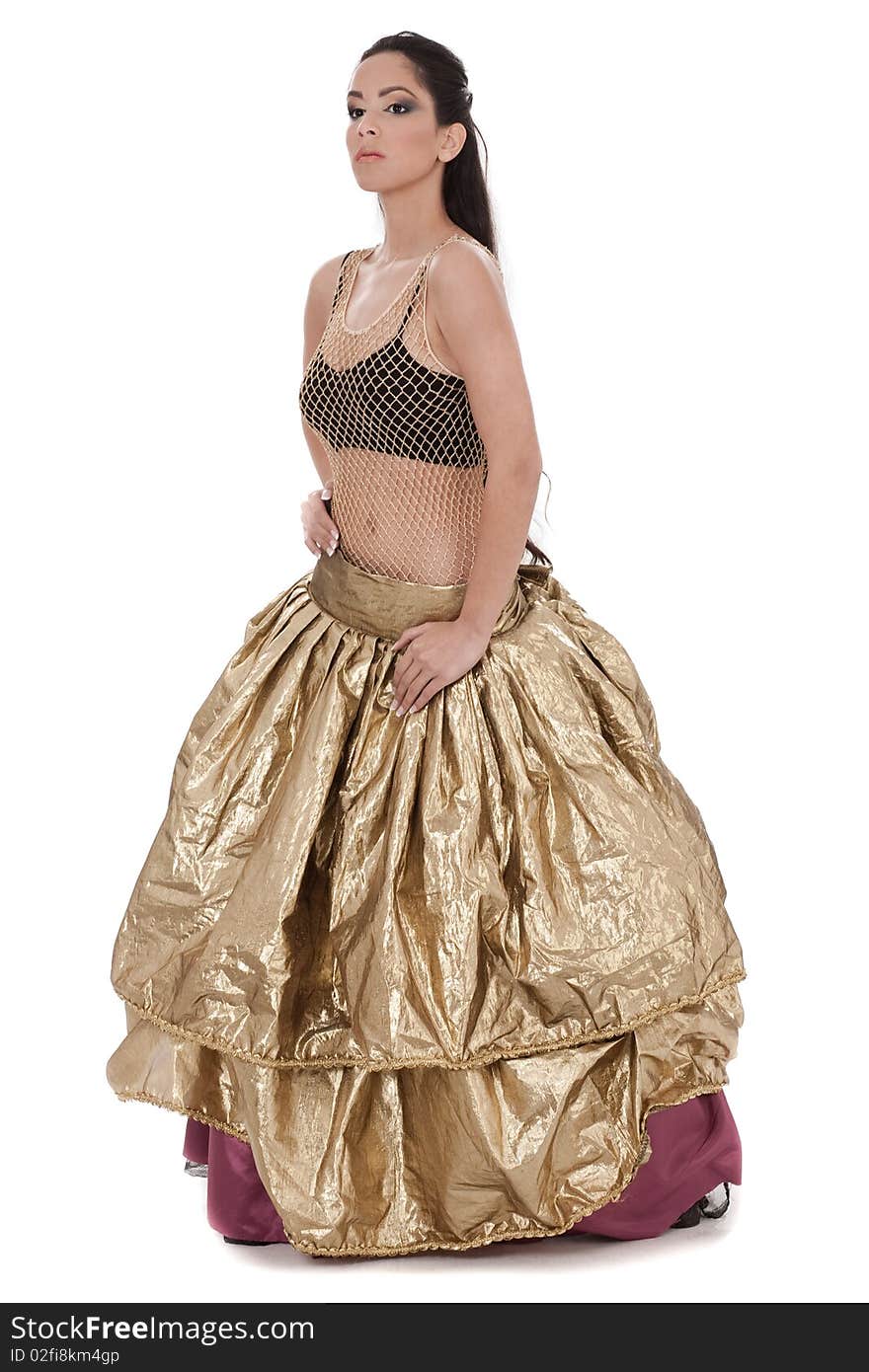 Traditional belly dancer in golden costume in white background