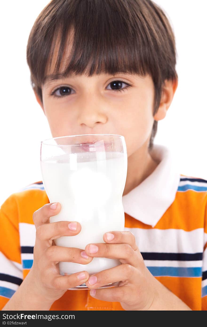 Happy kid drinking glass of milk on isolated background