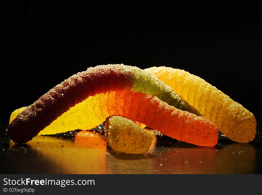 Sugar coated gelatine candy against black background. Sugar coated gelatine candy against black background