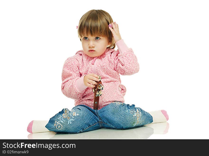 Little girl in jeans and pink sweater on white background. Little girl in jeans and pink sweater on white background