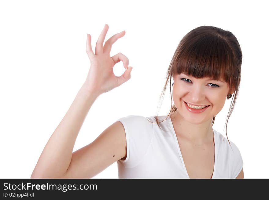 A charming young girl in a white T-shirt makes a sports exercise isolated on white