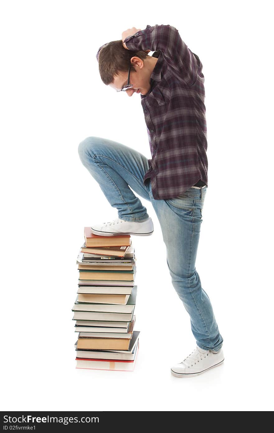 The young student with the books isolated on a white background