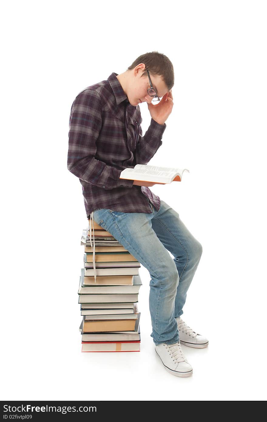 The young student with the books isolated on a white background