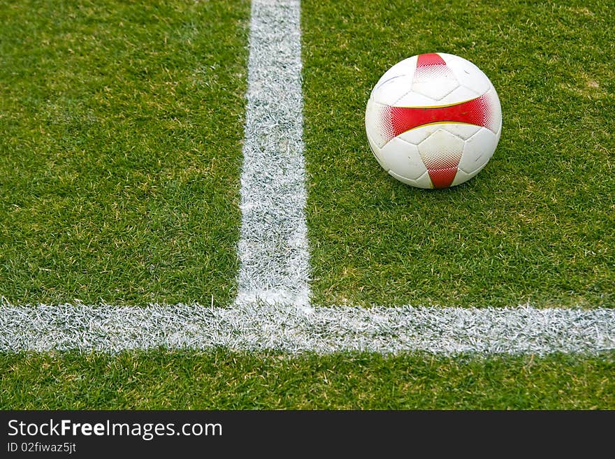 Soccer ball against grass background