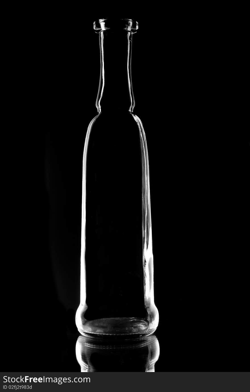 Bottle with a reflection on a black background