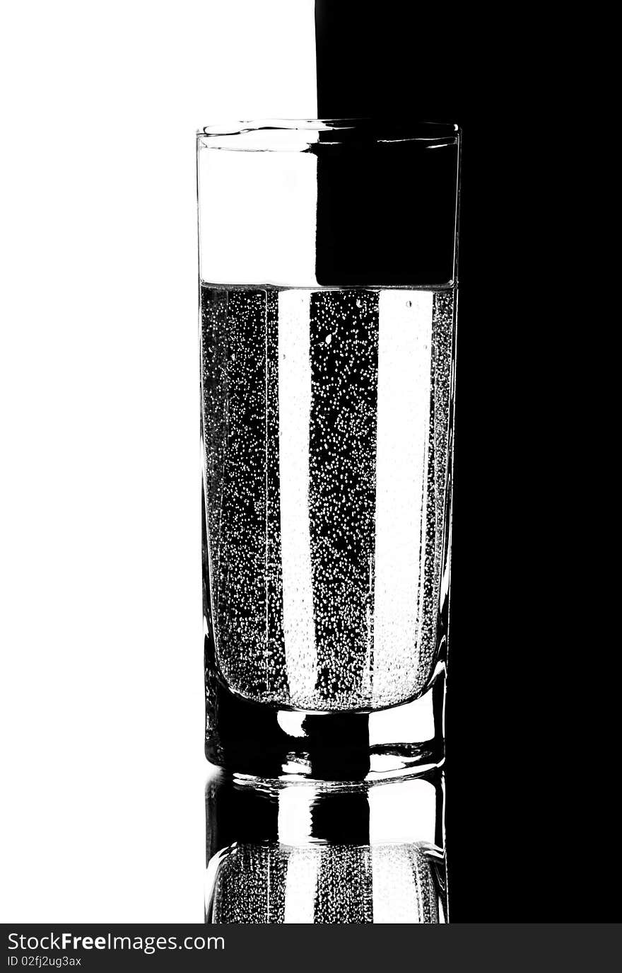 Glass with a reflection on a black background