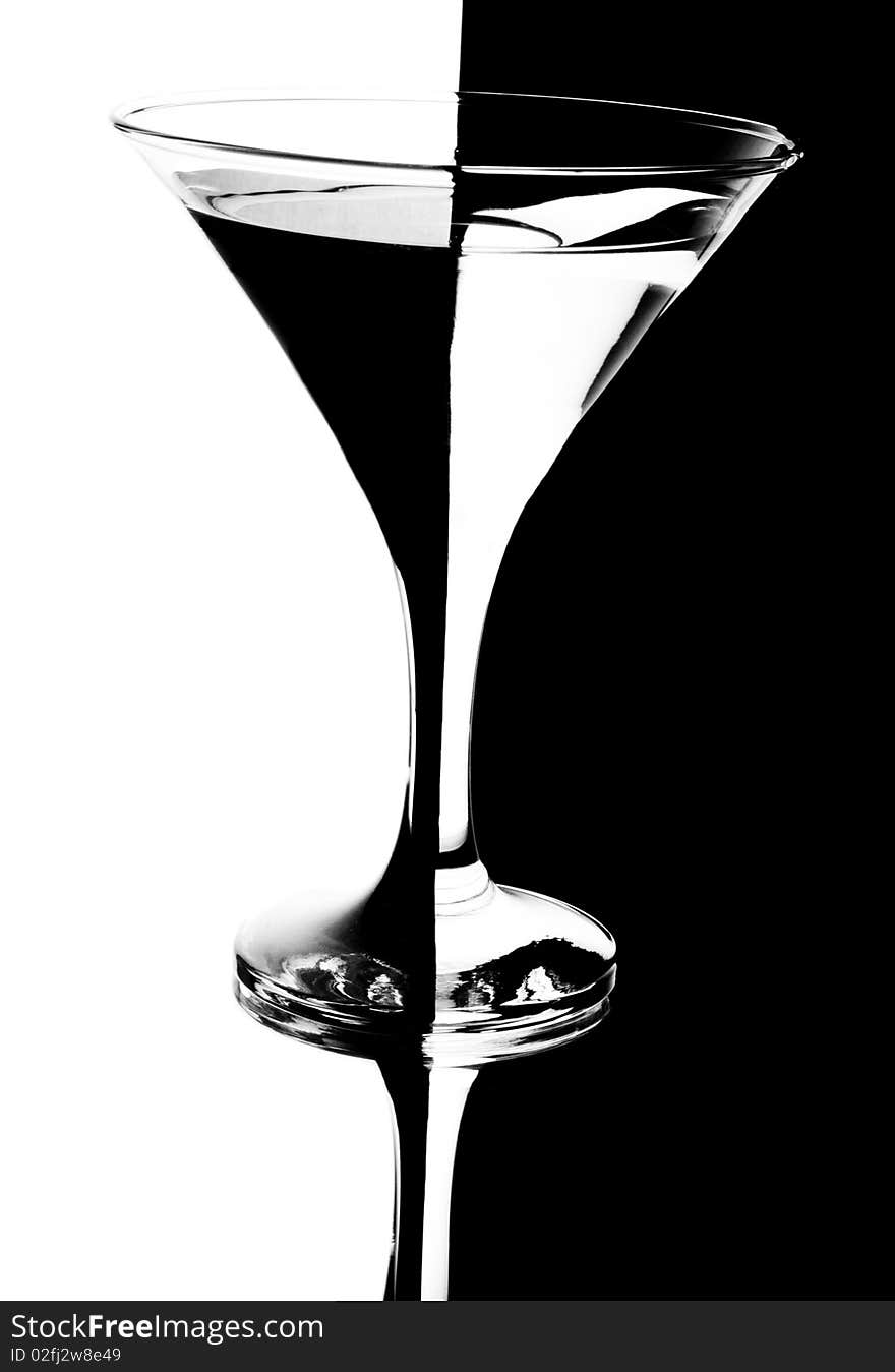 Tall wine glass for a martini on a black background