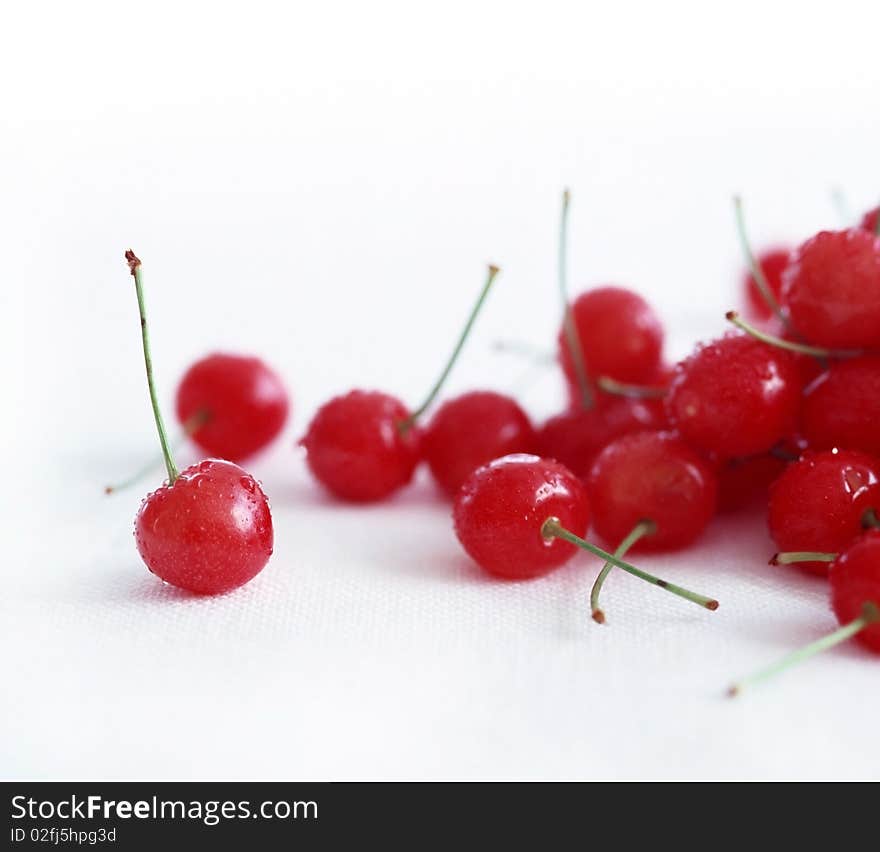 Fresh ripe cherries on a white background