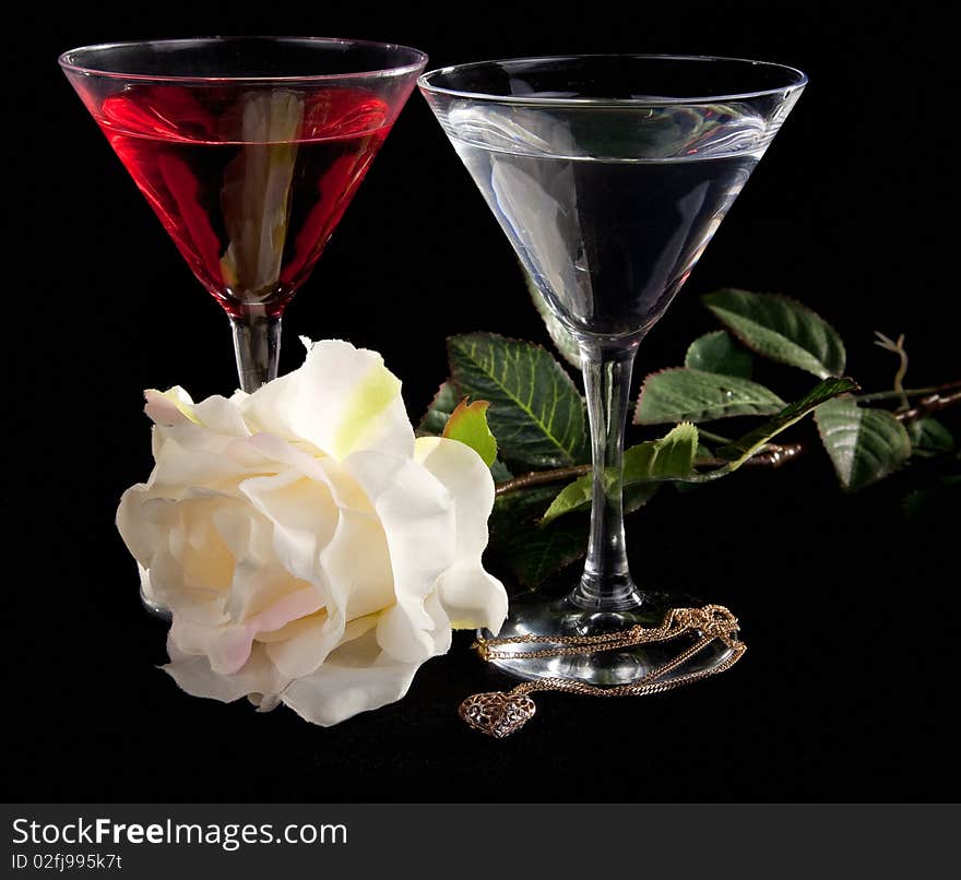 Rose and two glasses of cocktails on a white background