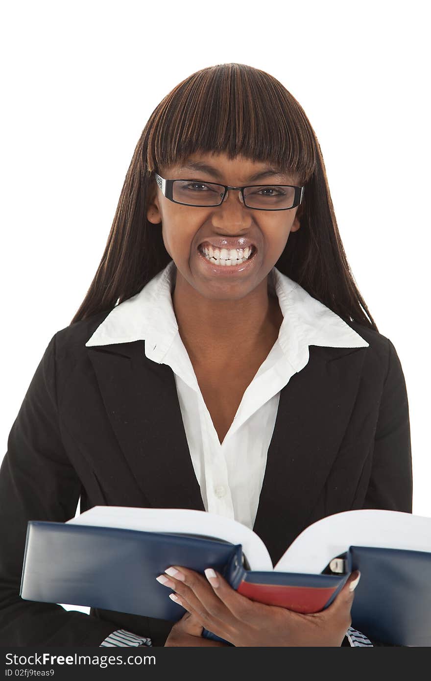 Young female student angry snarling at handbook