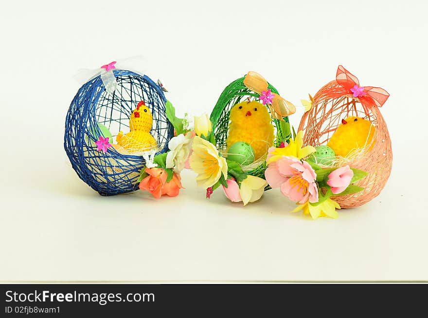 Three little easter chick coming out of a knitted egg. Three little easter chick coming out of a knitted egg