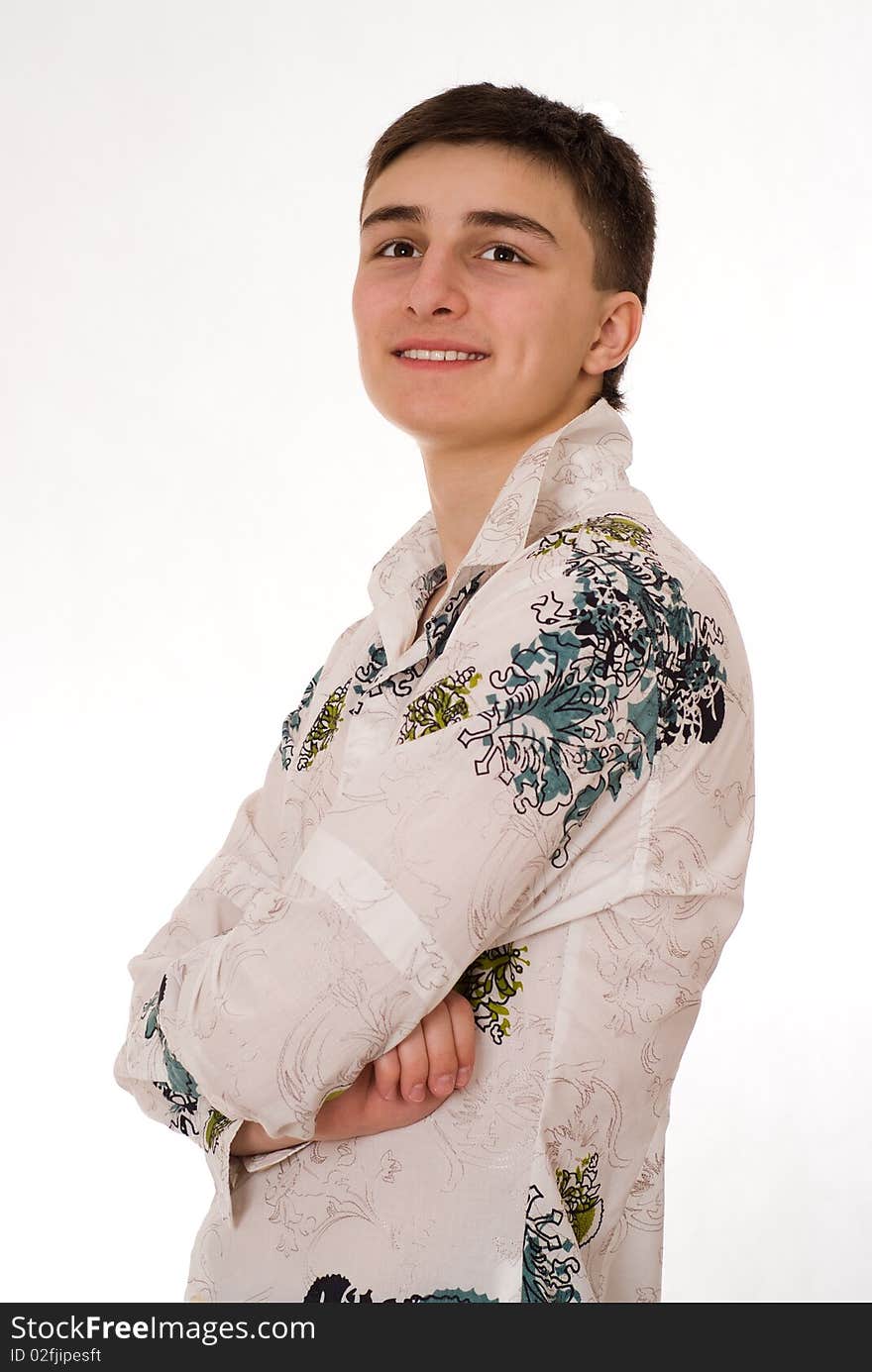 Beautiful young man standing on a white