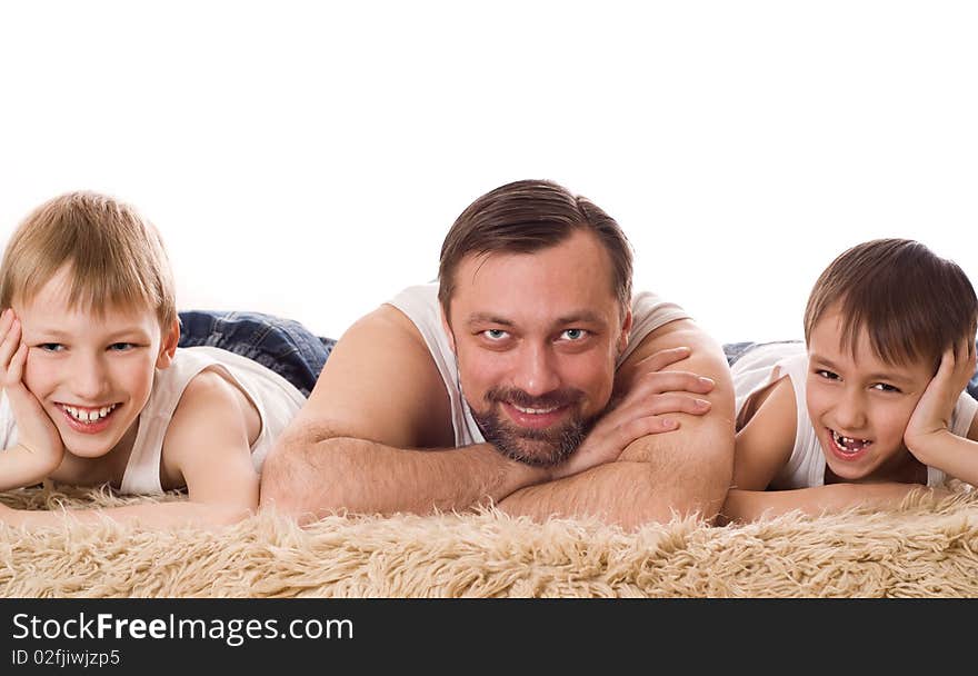 Young family three lying on the bed